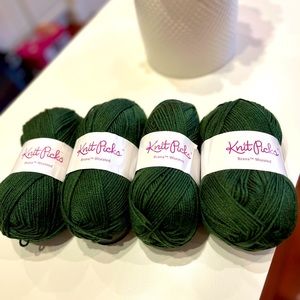 Four skeins, balls of Knit Picks worsted yarn. Color Dublin green